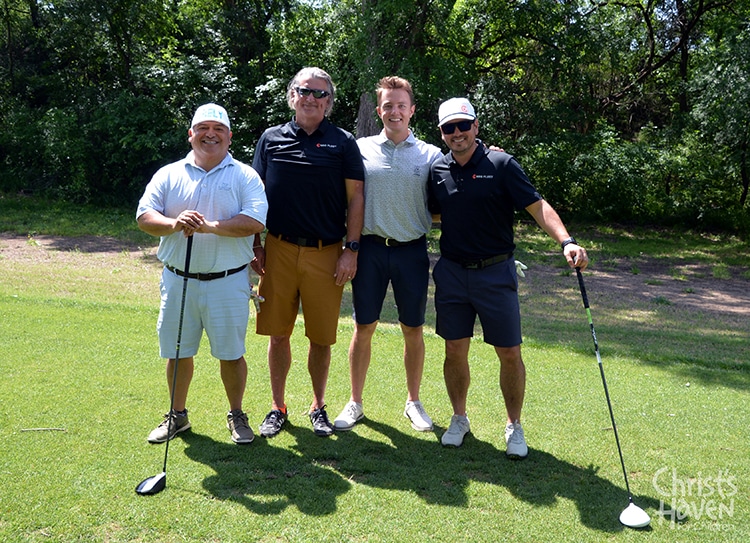 Foursome golf posing